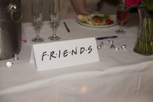 Friends sign for themed wedding