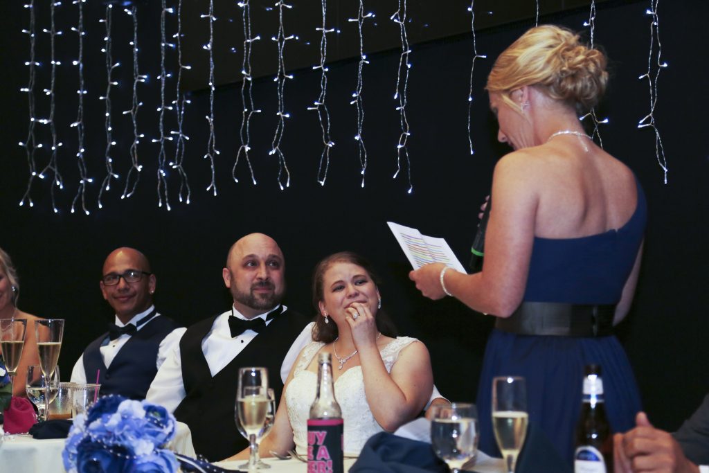 candid photo of maid of honor and bride