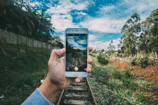 man taking photos with phone