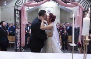 Bride and groom kiss at the end of ceremony