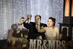 Bride and groom make a toast at Studio One Eleven