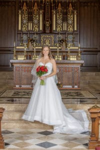 Bride poses on church alter