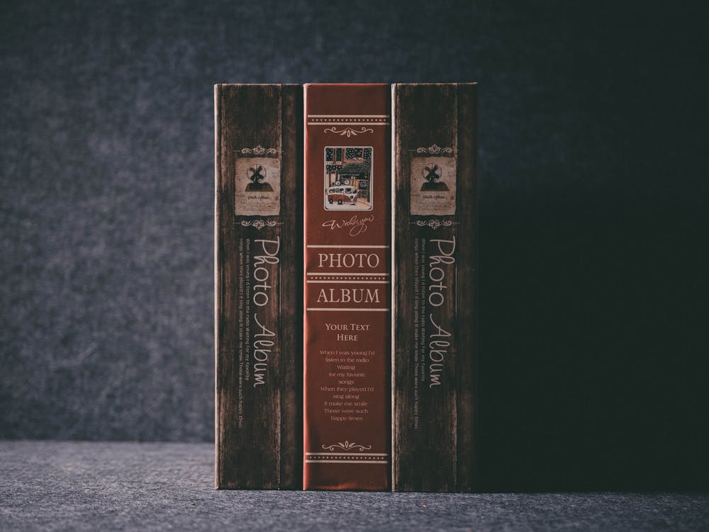 Three upright photo albums