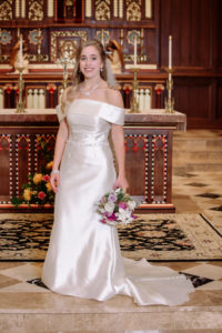 bride poses at the sanctuary