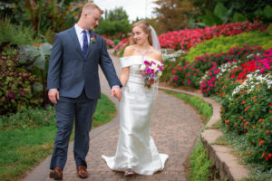 bride and groom walk at Sunken Garden