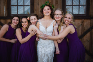 bridesmaids hug bride