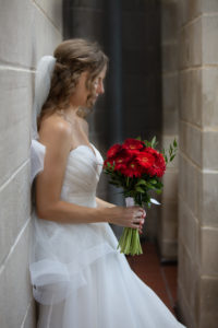bride looks at her flowers