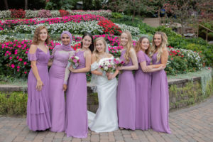 bridesmaids casually pose at Sunken Gardens