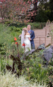 bride and groom kiss at Sunken Gardens