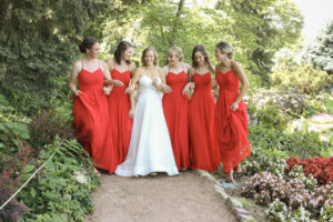 bridesmaids walk arm in arm