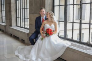 bride and groom sit in Capitol