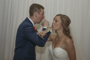bride and groom sip champagne