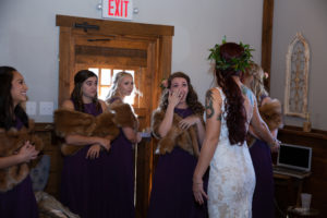 bridesmaids look at bride