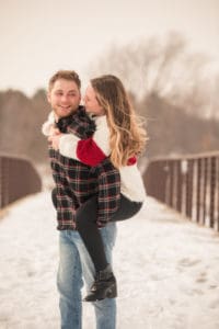 woman is on the back of man