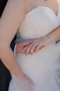 close up of bride and groom's hands