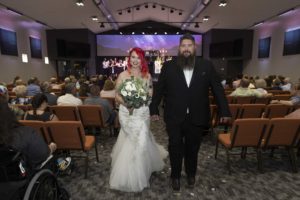 bride and groom walks down the aisle