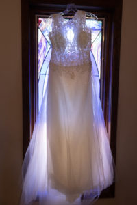 Detail shots of wedding dress in a window