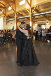 bride and groom kiss after first dance