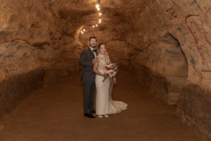 bride and groom in Robber's Cave hallway