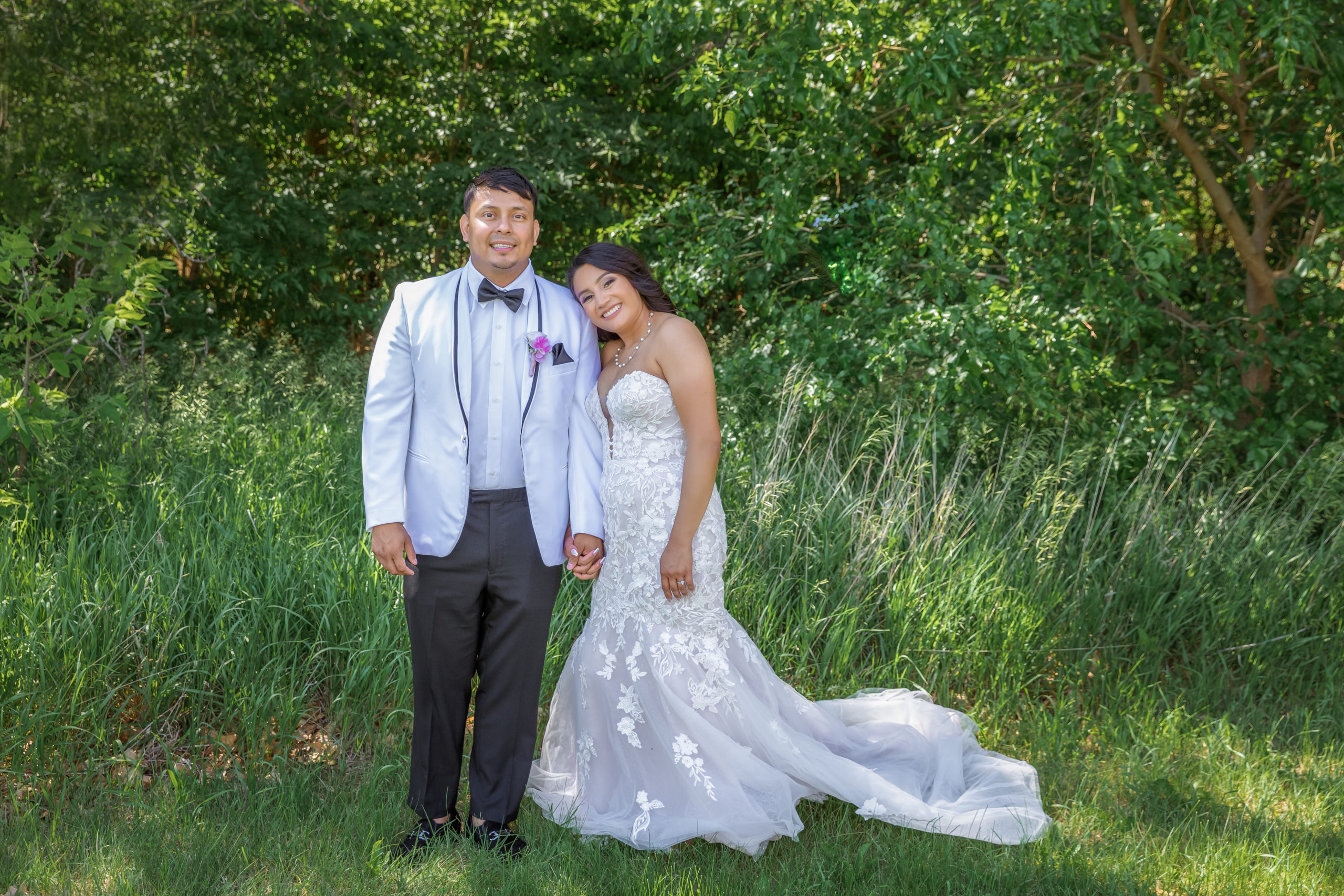 bride and groom leaning on each other in greenery Hidden Valley Golf Club Wedding
